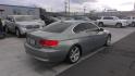 2007 GREEN BMW 3-Series 328xi Coupe (WBAWV535X7P) with an 3.0L L6 DOHC 24V engine, located at 502 S. Riverside Avenue, Medford, OR, 97501, (541) 773-3136, 42.322803, -122.867477 - Photo#2