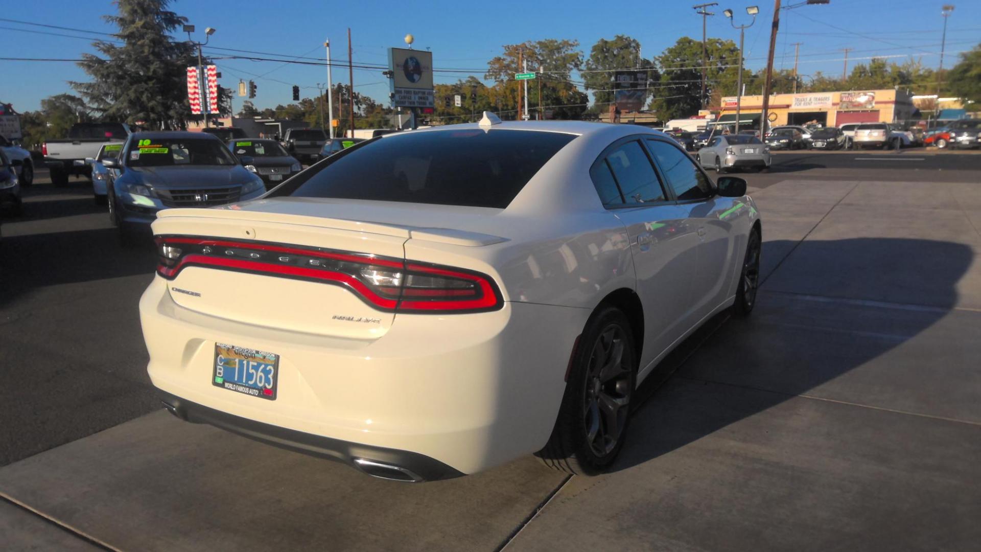 2016 WHITE Dodge Charger SXT (2C3CDXHG7GH) with an 3.6L V6 DOHC 24V engine, 8A transmission, located at 502 S. Riverside Avenue, Medford, OR, 97501, (541) 773-3136, 42.322803, -122.867477 - Photo#2