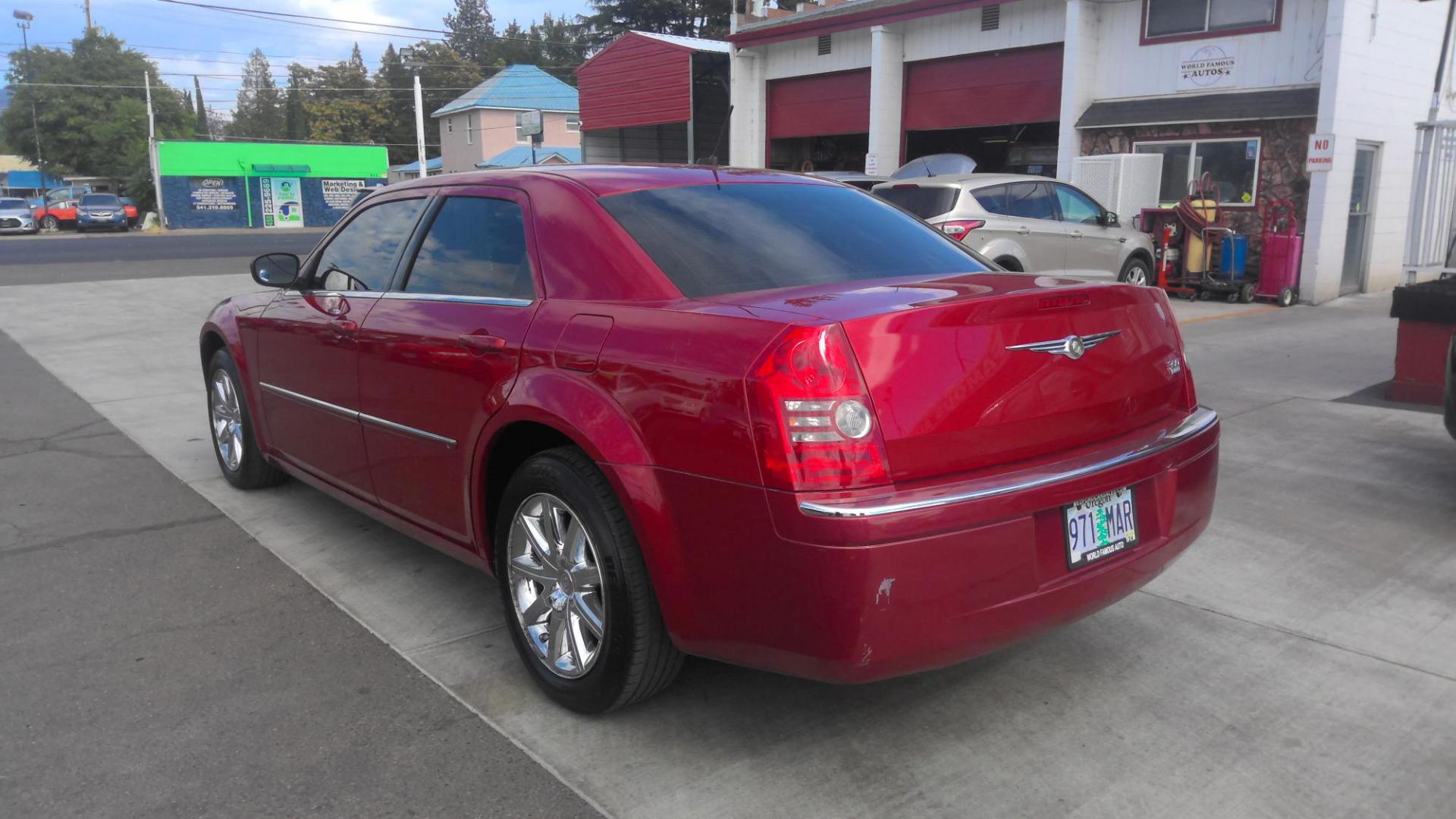 2008 RED Chrysler 300 Limited (2C3LA33G28H) with an 3.5L V6 DOHC 24V engine, 4-Speed Automatic transmission, located at 502 S. Riverside Avenue, Medford, OR, 97501, (541) 773-3136, 42.322803, -122.867477 - Photo#2