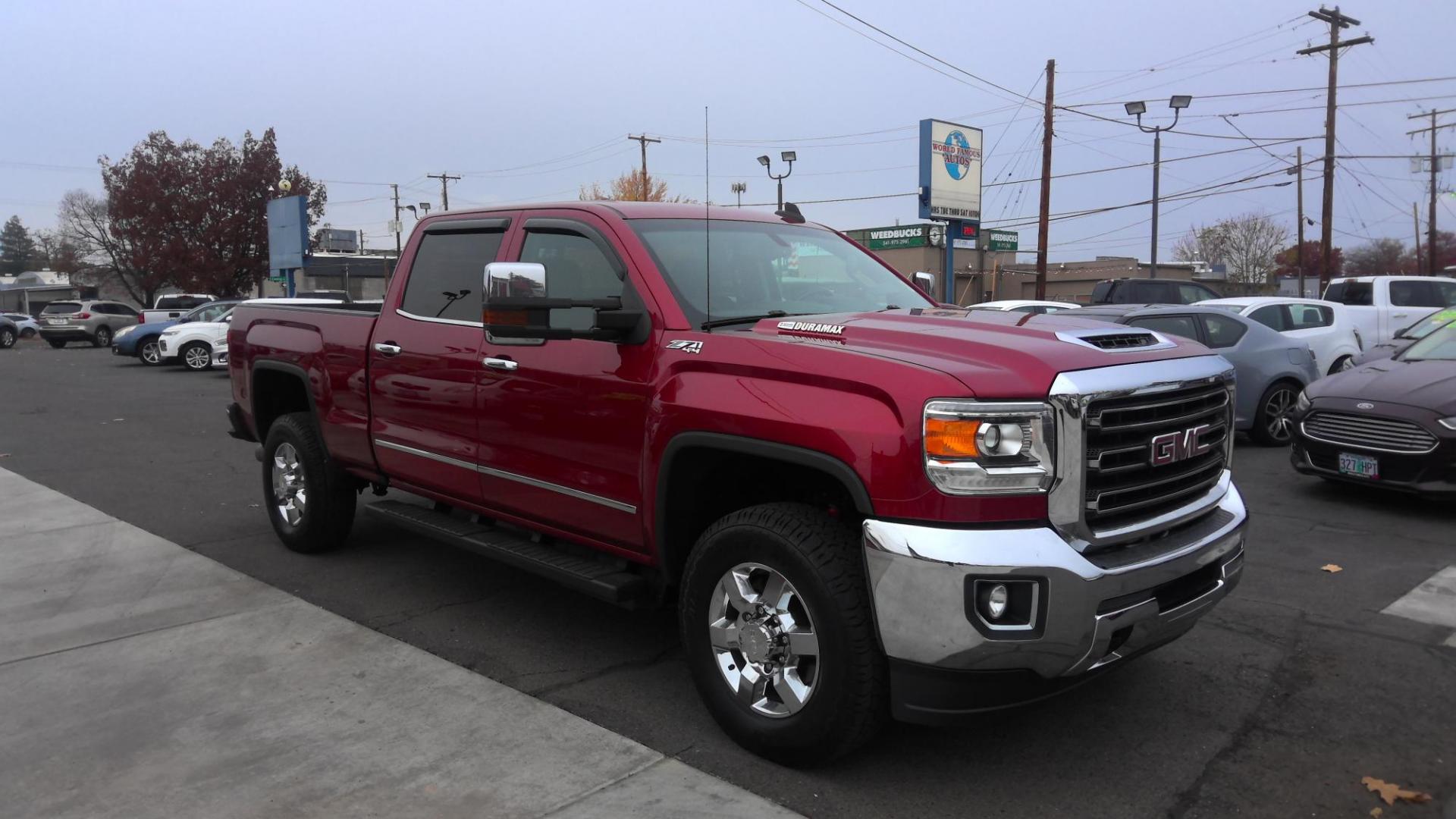 2019 RED /Black GMC Sierra 3500HD SLT Crew Cab 4WD (1GT42VCYXKF) with an 6.6L V8 OHV 16 DIESEL engine, 6A transmission, located at 502 S. Riverside Avenue, Medford, OR, 97501, (541) 773-3136, 42.322803, -122.867477 - This 6.6L Duramax GMC Sierra 3500 is a CARFAX 1-Owner as a great heavy-duty crew cab pickup truck. - Photo#2