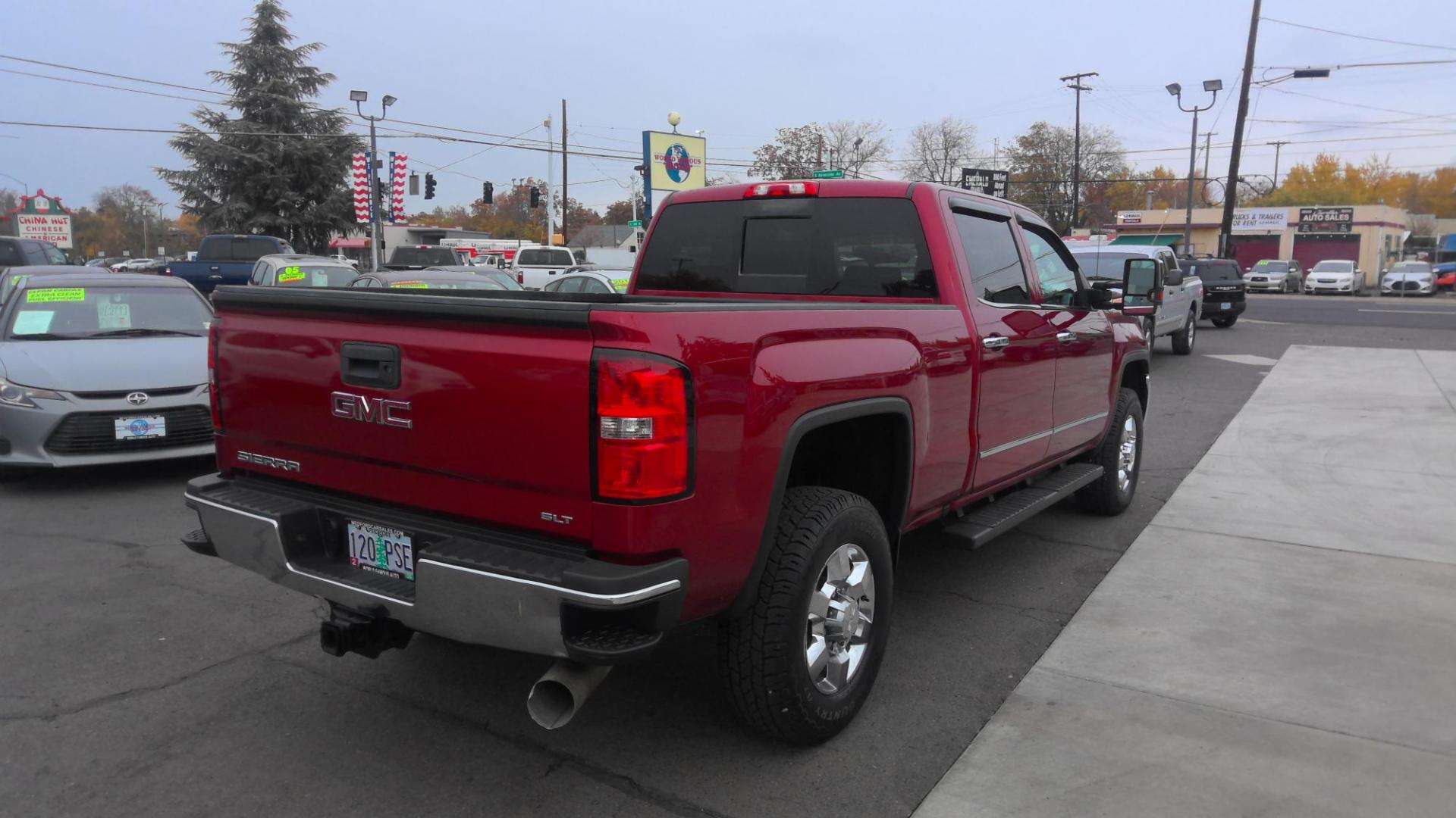 2019 RED /Black GMC Sierra 3500HD SLT Crew Cab 4WD (1GT42VCYXKF) with an 6.6L V8 OHV 16 DIESEL engine, 6A transmission, located at 502 S. Riverside Avenue, Medford, OR, 97501, (541) 773-3136, 42.322803, -122.867477 - This 6.6L Duramax GMC Sierra 3500 is a CARFAX 1-Owner as a great heavy-duty crew cab pickup truck. - Photo#3