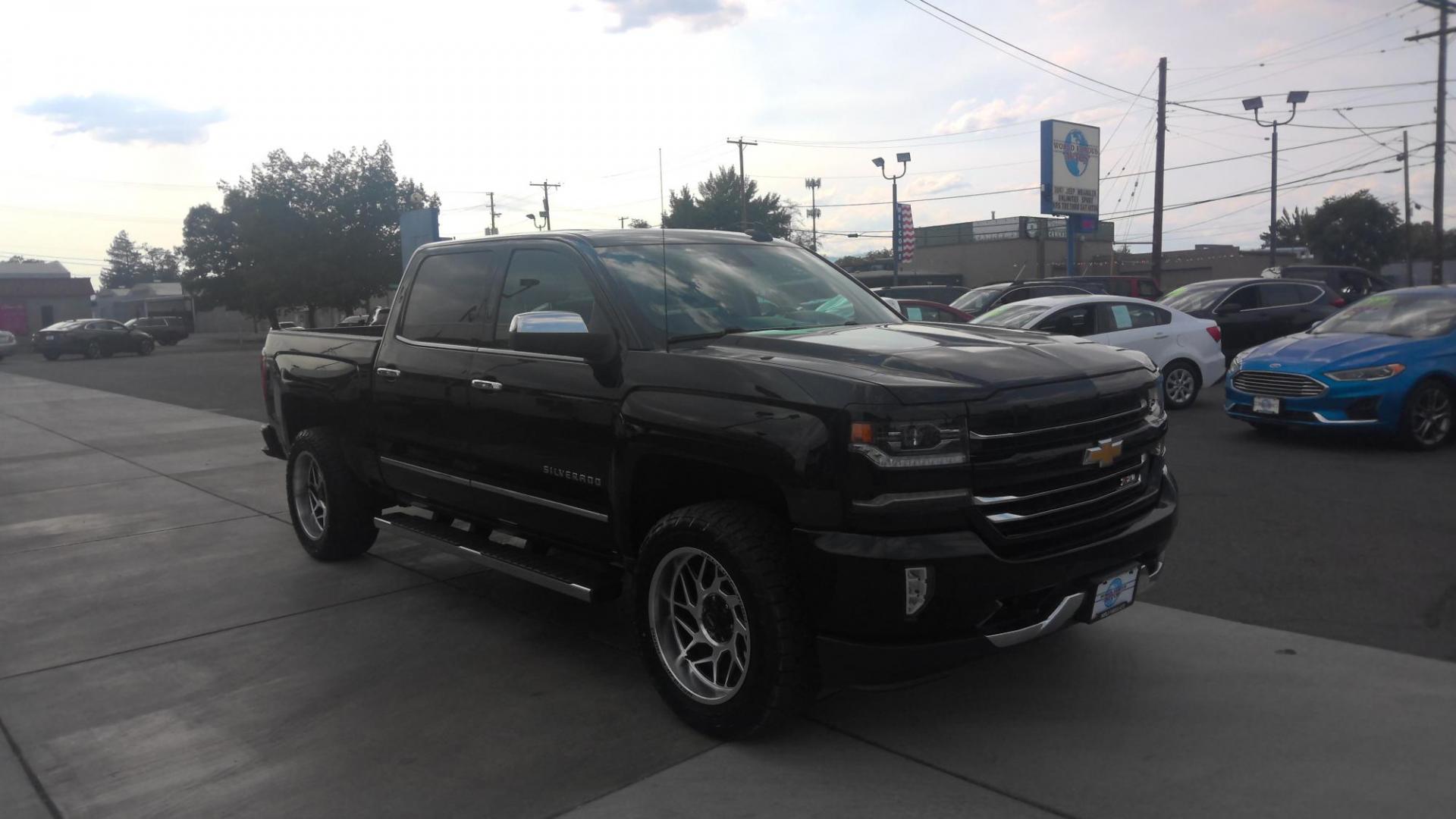 2018 BLACK Chevrolet Silverado 1500 LTZ Crew Cab 4WD (3GCUKSEJ0JG) with an 6.2L V8 OHV 16V engine, 6A transmission, located at 502 S. Riverside Avenue, Medford, OR, 97501, (541) 773-3136, 42.322803, -122.867477 - Photo#1