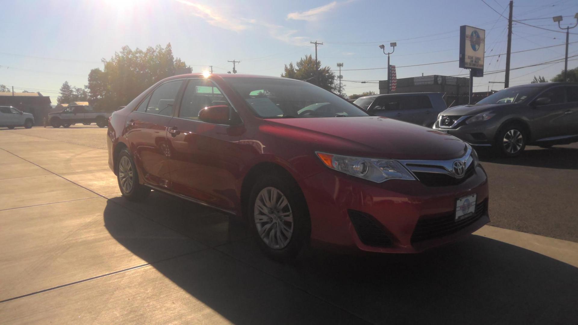 2014 RED Toyota Camry L (4T4BF1FK4ER) with an 2.5L L4 DOHC 16V engine, 6-Speed Automatic transmission, located at 502 S. Riverside Avenue, Medford, OR, 97501, (541) 773-3136, 42.322803, -122.867477 - Photo#1