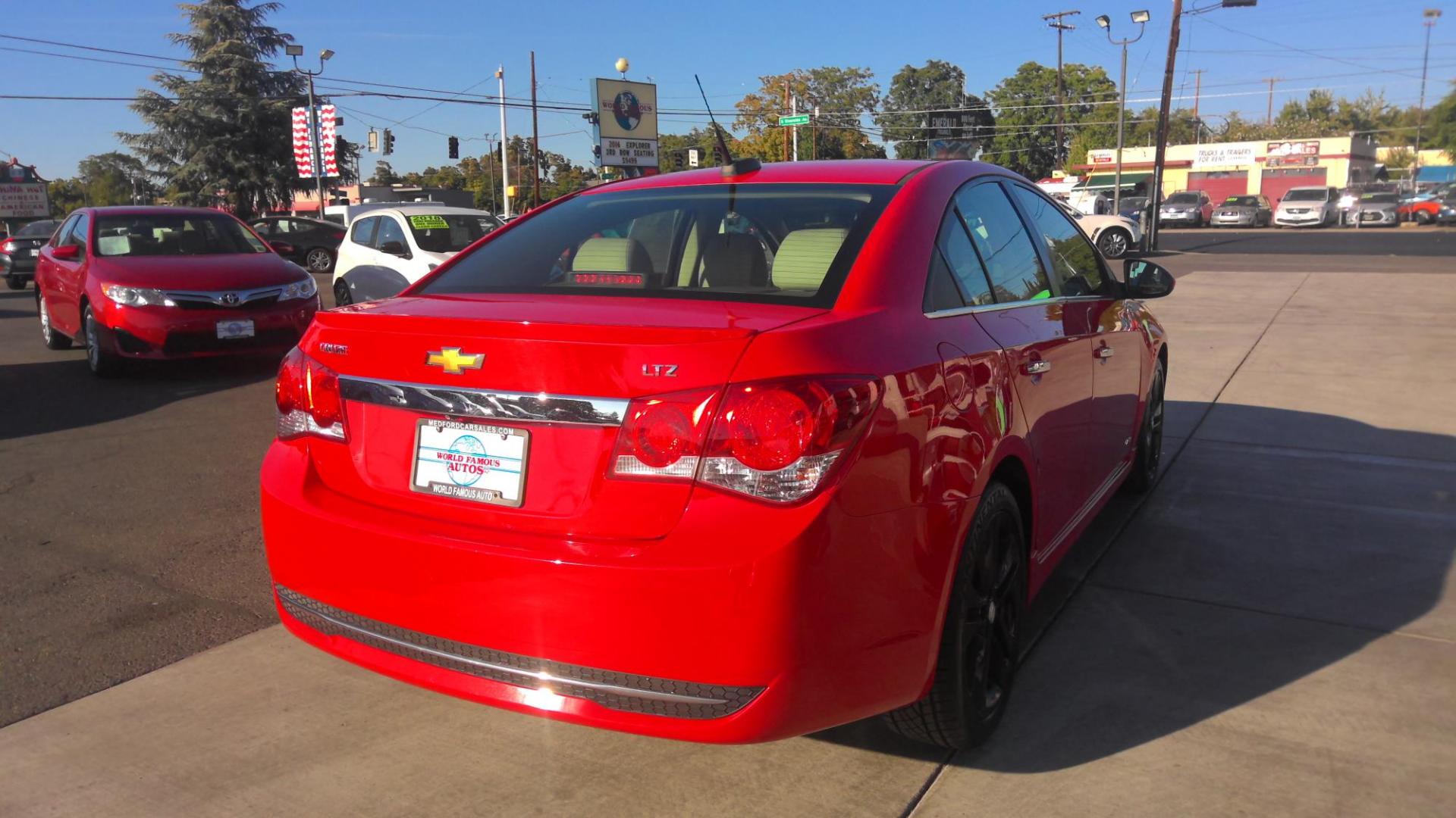 2015 RED Chevrolet Cruze LTZ Auto (1G1PG5SB1F7) with an 1.4L L4 DOHC 16V TURBO engine, 6-Speed Automatic transmission, located at 502 S. Riverside Avenue, Medford, OR, 97501, (541) 773-3136, 42.322803, -122.867477 - Photo#4