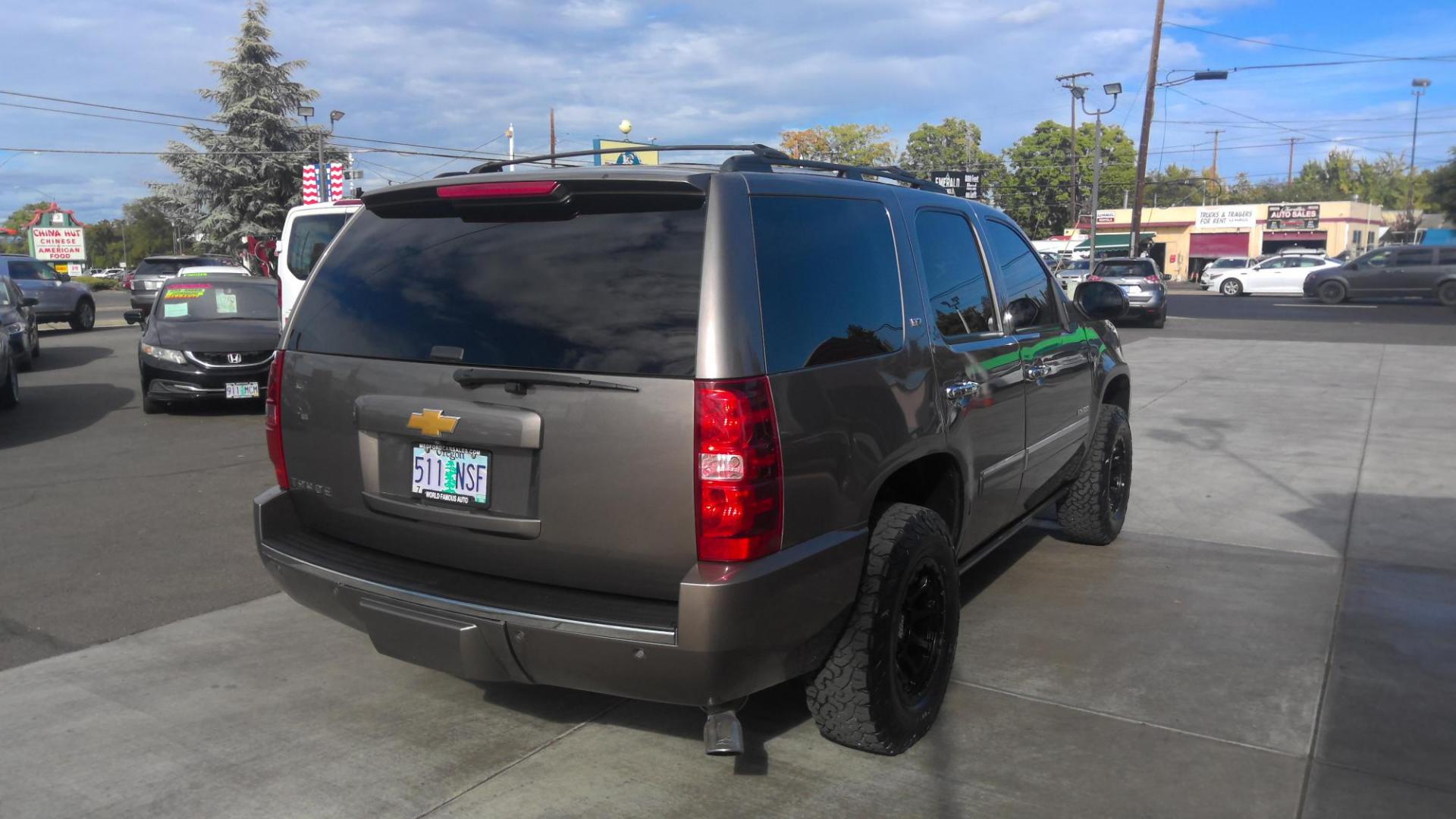 2013 BROWN Chevrolet Tahoe LTZ 4WD (1GNSKCE02DR) with an 5.3L V8 OHV 16V FFV engine, 6-Speed Automatic transmission, located at 502 S. Riverside Avenue, Medford, OR, 97501, (541) 773-3136, 42.322803, -122.867477 - Photo#2