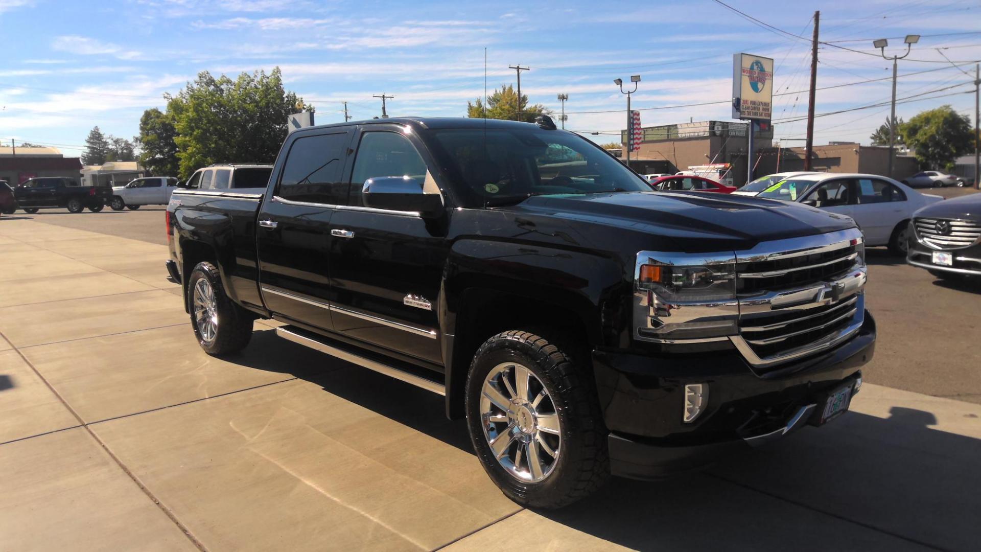 2017 BLACK Chevrolet Silverado 1500 High Country Crew Cab Short Box 4WD (3GCUKTEC4HG) with an 5.3L V8 OHV 16V engine, 6A transmission, located at 502 S. Riverside Avenue, Medford, OR, 97501, (541) 773-3136, 42.322803, -122.867477 - Photo#1